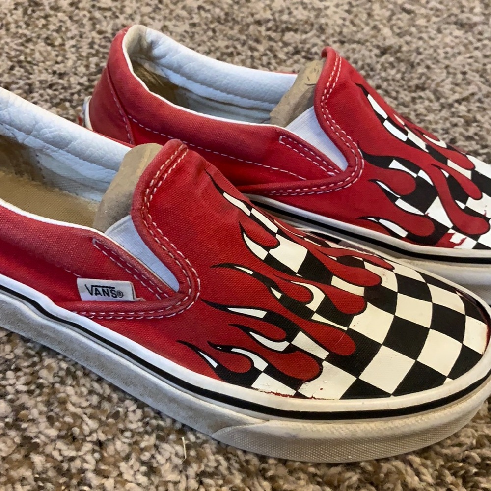 Vans with checker and red flames.